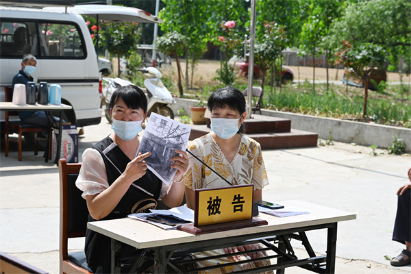 唐河县法院：私搭乱建起纷争，村部响起法槌声