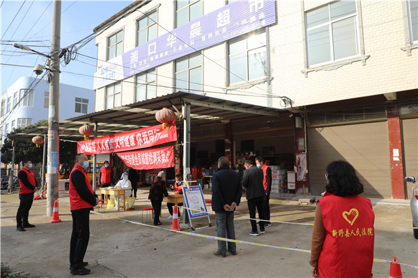 新野县法院：志愿者下沉社区  助力全员核酸检测